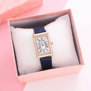 Square rose gold women's watch with rhinestones and navy leather strap in gift box