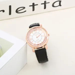 Detailed macro view of a rose gold quartz watch with Roman numerals and sparkling crystals