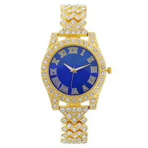 Macro view of luxury gold quartz watch with diamond bezel and blue sunray dial