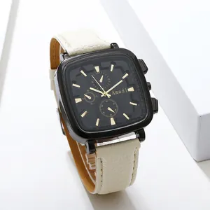 Fashionable square quartz watch with black dial and cream leather strap on white pedestal