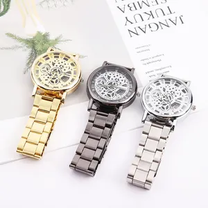 Trois montres mécaniques squelettes pour hommes en acier or, argent et gris anthracite
