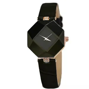 Detailed macro view of an octagonal faceted glass dial watch with black leather strap