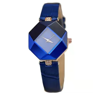 Women's quartz watch with blue faceted glass dial and rose gold case on white background