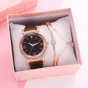 Close-up of women's star dial watch with magnetic mesh band and diamond bracelet in gift box