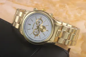 Detail view of gold quartz watch featuring a white dial and three decorative sub-dials