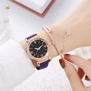 Detailed view of purple magnetic mesh band watch and star charm bracelet on wrist