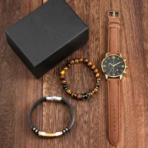 Close-up of Geneva men's watch and beaded bracelets set in a black luxury gift box