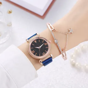 Detail of rose gold starry sky watch with mesh band and matching crystal star bracelet