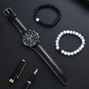 Men's quartz watch gift set with black leather strap and two beaded bracelets on dark background