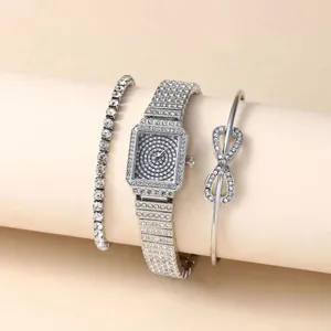 Detail of silver square quartz watch set with infinity bracelet and tennis chain