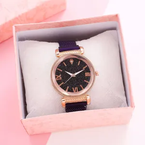 Detailed shot of star pattern dial watch with purple mesh band and magnetic buckle in gift box