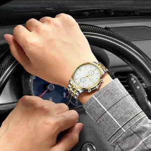 Close-up of luxury gold-silver stainless steel men watch in a car driving scenario