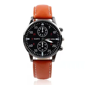 Macro shot of men's quartz watch with brown leather strap and black pilot-style dial