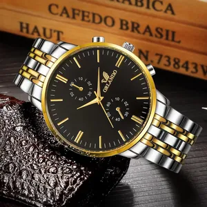 Close-up of luxury two-tone stainless steel watch with black dial and gold indices