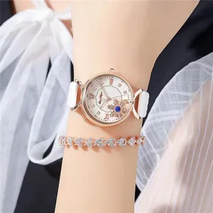 Detail of rose gold watch with snowflake dial and matching crystal heart bracelet