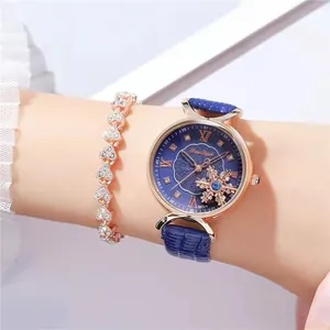 Women's rose gold fashion watch with blue leather strap and heart-shaped bracelet set