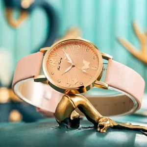 Minimalist women's quartz watch featuring rose gold butterfly dial and pink leather strap