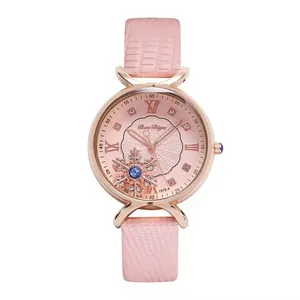 Women's rose gold quartz watch with pink leather strap and snowflake dial detail