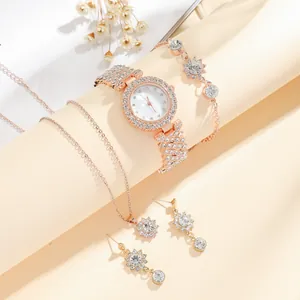Elegant rose gold women's watch set with diamond accents and matching jewelry kit