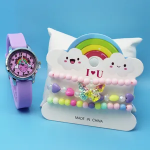 Detail of girls' quartz watch set with rainbow heart dial and three beaded bracelets