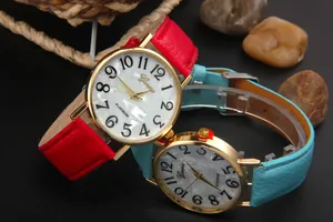 Detail view of Geneva watches with shell crystal dial in red and light blue leather straps
