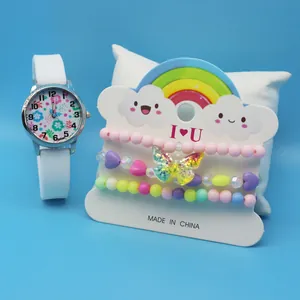 Detail view of children's floral watch and beaded bracelets on display card