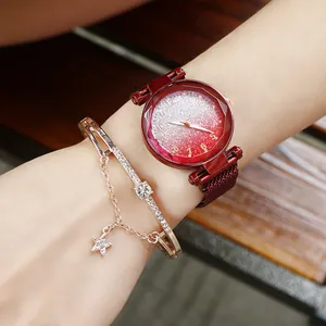 Detail of burgundy starry watch face and matching rose gold star bracelet set