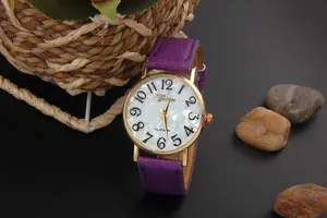 Detailed side view of Geneva watch with purple leather strap and golden case