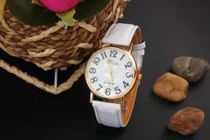 Close-up of Geneva quartz watch with white leather strap and shell texture dial