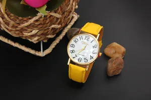 Detail of Geneva quartz watch with yellow leather strap and large numeric dial
