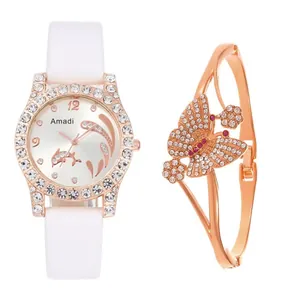 Close-up of rose gold dolphin watch with crystal bezel and matching butterfly bracelet