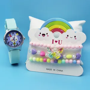 Detail of light blue cartoon kids watch with colorful beaded butterfly bracelet set
