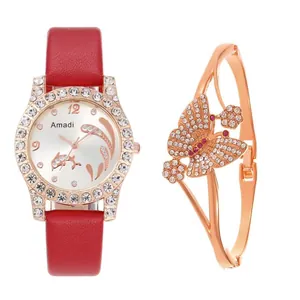 Detailed view of women's gold rhinestone watch with red leather strap and butterfly bangle