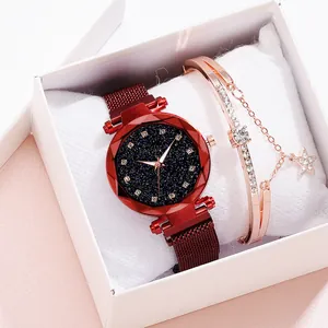 Women's watch set featuring red mesh strap watch and rose gold star bracelet in a gift box