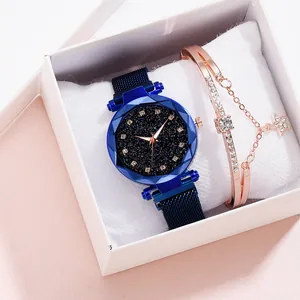 Detail of starry blue square watch with Milanese band and rose gold star bracelet set