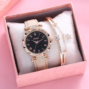 Detail eines Damen-Uhr- und Diamant-Stern-Armband-Sets in einer rosa Geschenkbox