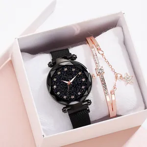 Close-up of women's starry sky watch with mesh band and diamond bracelet in a gift box