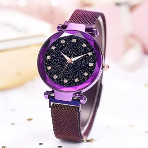 Macro shot of purple Milanese loop strap and starry dial watch with rhinestone markers