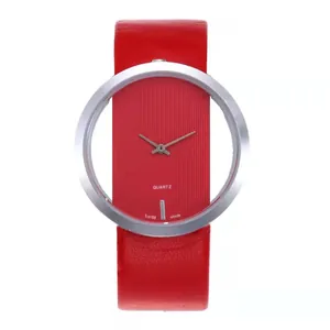 Macro view of red minimalist quartz watch with hollow silver case and leather strap