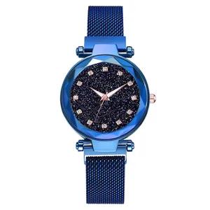 Detail of blue starry watch dial with Milanese loop band and magnetic buckle closure