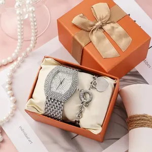 Detailed luxury watch set with iced-out square dial and matching heart charm bracelet