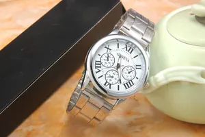 Silver stainless steel Geneva watch with white Roman dial resting on a black gift box