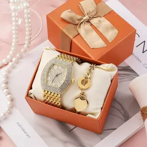 Luxury gold square watch with crystal embellishments and heart pendant bracelet set in gift box