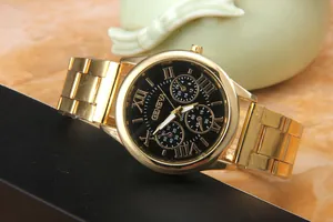 Close-up of Geneva gold steel watch featuring a black dial with Roman numeral markers