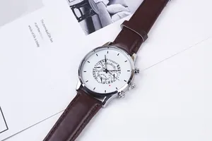 Detail of classic business quartz watch with silver metal case and brown leather strap