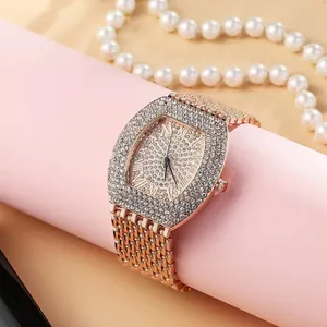 Luxury rose gold tonneau watch with rhinestone pavé dial and Roman numerals for women