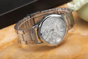 Detailed macro view of Geneva quartz watch with gold Roman numerals and silver metal band