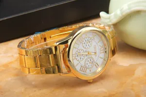 Detailed close-up of Geneva gold steel watch dial with Roman numerals and three sub-dials