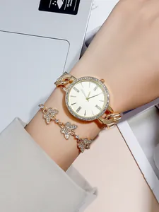 Elegant gold quartz watch with rhinestone bezel and matching butterfly bracelet set