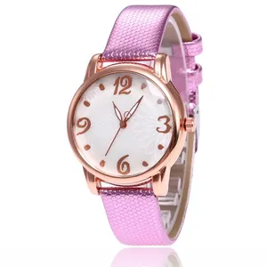 Close-up of pink snakeskin pattern strap and daisy print dial on quartz watch